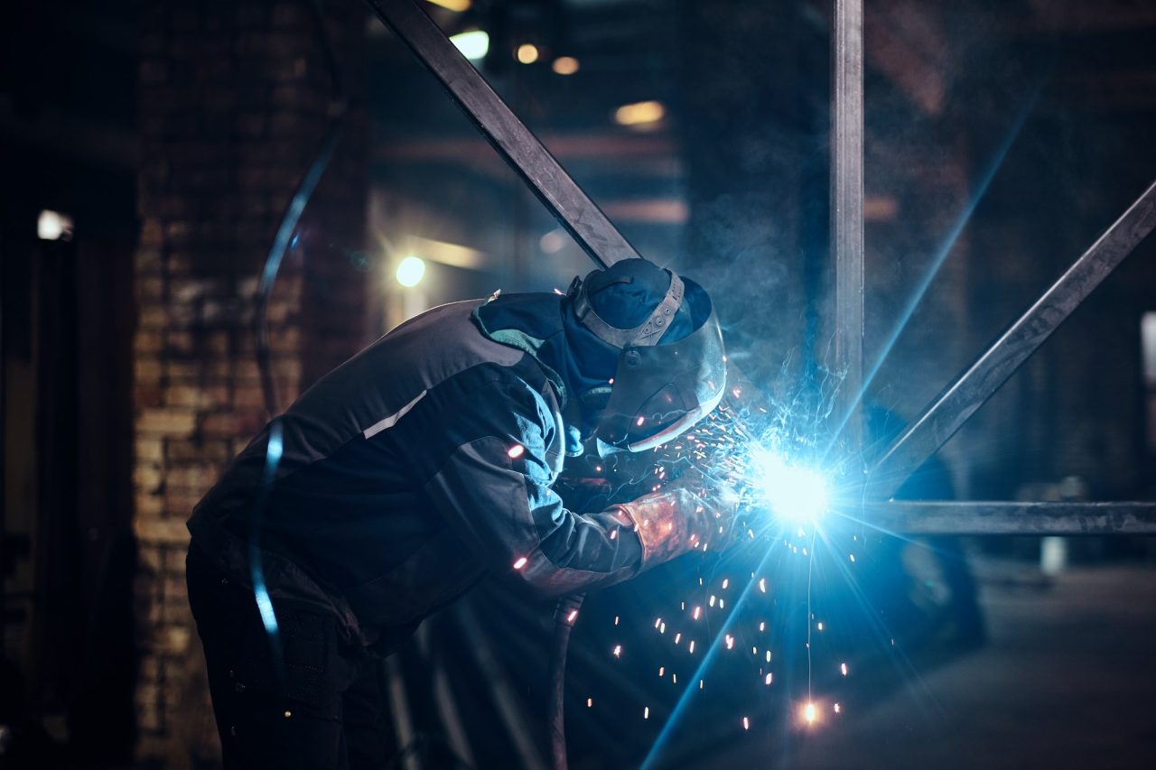man-is-working-at-the-busy-metal-factory.jpg